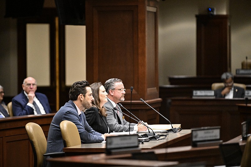 Chad Brown (from left), chief financial officer for the Department of Corrections, Ann Laidlaw, director of the TSS Division of Building Authority, and Nathan Alderson, state architect for the Arkansas Building Authority, answer questions from legislators Monday during the ALC Review Subcommittee meeting at the state Capitol..(Arkansas Democrat-Gazette/Staci Vandagriff)